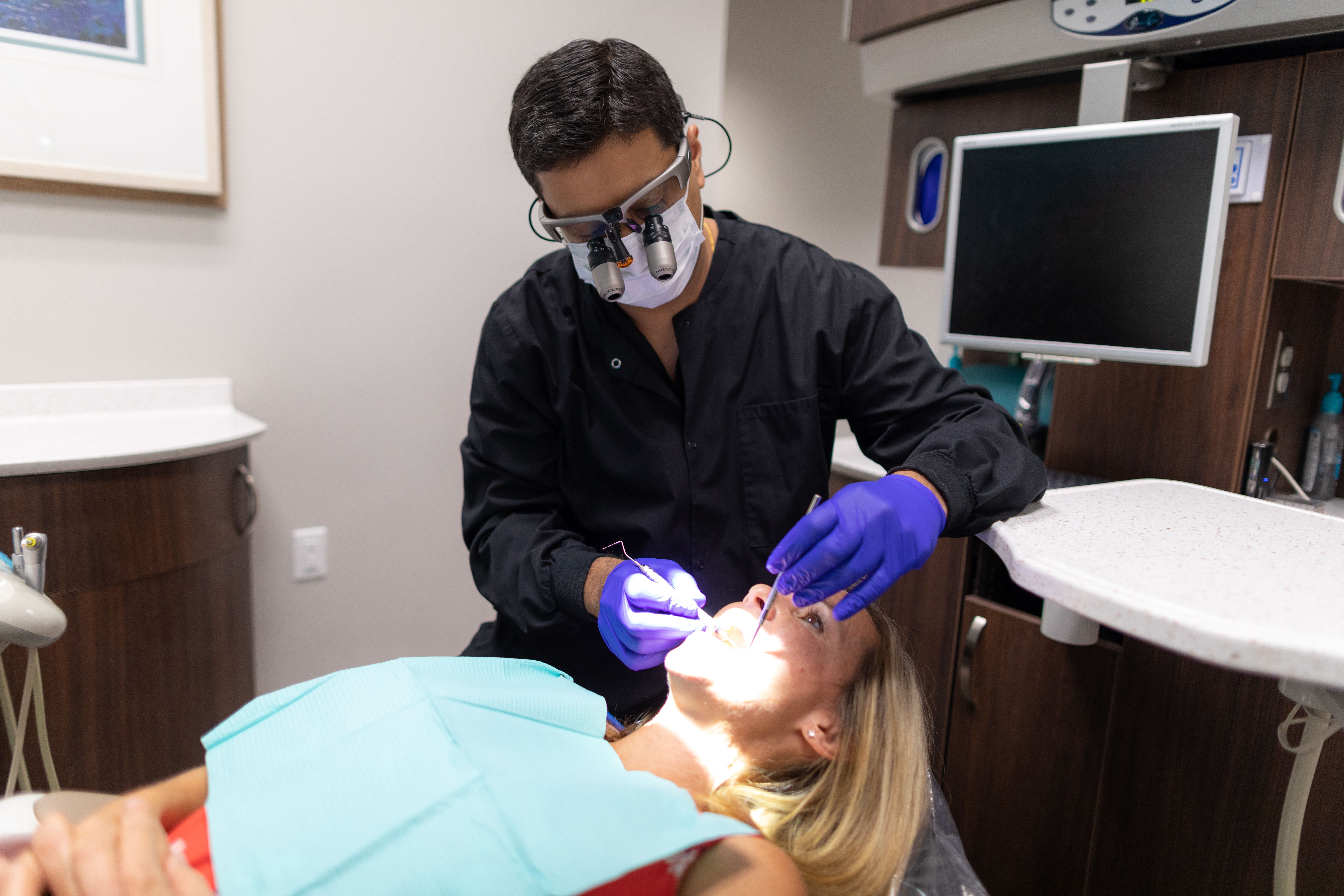 Dentist conducting dental exam